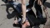 An antigay protester uses pepper spray against gay-rights activists during an LGBT rally in central Moscow in May.