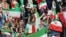 Iranian women cheer during the FIFA World Cup qualier between Iran and Cambodia in Tehran in 2019.