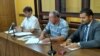 Mykola Semena (center) in court in the Crimean capital, Simferopol, on August 31.