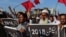 Supporters of Awami National Party (ANP) protest against alleged election rigging in Peshawar on July 30.