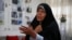 Faezeh Hashemi speaks to an interviewer in Tehran on September 6.