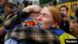 An emotional reunion as Ukrainians return home amid a prisoner exchange with Russia on May 25.