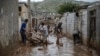 Men clear away mud following floods in the Iranian city of Mamulan in Lorestan Province on April 7.