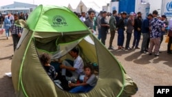 خانواده های برگشته از ایران به منطقۀ مرزی اسلام قلعه 