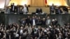 Members of parliament shout slogans calling for the execution of opposition leaders Mir Hossein Musavi and Mehdi Karrubi. 