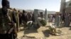 Afghan Taliban shows the wreckage of what they say is a U.S. plane shot down in southeastern Afghanistan on October 14.