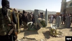 Afghan Taliban shows the wreckage of what they say is a U.S. plane shot down in southeastern Afghanistan on October 14.