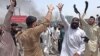 FILE: Members of minority Sikh community shout protest in the northwestern city of Peshawar.