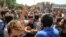 The protest came a day after demonstrators forced two major mobile-phone and electronics shopping centers in Tehran to close.
