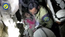 Rescuers Pull Girl From Rubble In Bombed-Out Aleppo