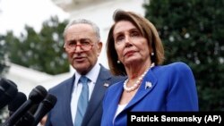 House Speaker Nancy Pelosi (right) and Senate Minority Leader Chuck Schumer and two others made the demand in a letter to the FBI released on July 20.