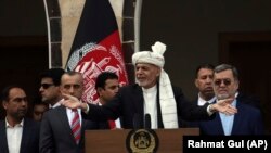 Afghan President Ashraf Ghani making a speech speaks to hundreds of after a few rockets were fired during his speech after he was sworn in at an inauguration ceremony at the presidential palace in Kabul, March 9, 2020