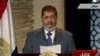 Egyptian President-elect Muhammad Morsi speaks during his first televised address to the nation in Cairo on June 24.