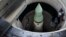 An unarmed Minutemen intercontinental ballistic missile is seen in its launch tube at a launch facility just outside Wall, South Dakota.