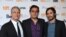 "Rosewater" film director Jon Stewart, Iranian subject Maziar Bahari, and Mexican actor Gael Garcia Bernal (left to right) pose at the Toronto film festival on September 8.