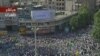 A screen grab from Iranian TV shows thousands of Ahmadinejad supporters rallying in Vali Asr Square in Tehran on June 16.