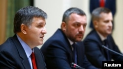 Acting Interior Minister Arsen Avakov speaks alongside acting Prosecutor-General Oleh Makhnytsky, and Ukrainian Security Service (SBU) chief Valentyn Nalyvaychenko (left to right) at a news conference in Kyiv on April 3.
