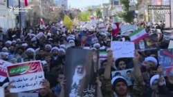 Government Supporters Shown On Iran's Streets In Wake Of Protests
