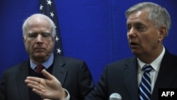 U.S. Senator Lindsey Graham (right) and Senator John McCain (left) both stopped short of calling for air strikes.
