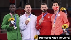 Карате боюнча Токио Олимпиадасынын (кумите, +75 кг.) байге ээлери ирандык Саджад Ганжадзе (алтын), Сауд Арабиялык Тарег Хамеди (күмүш), жапониялык Рутаро Агара жана түркиялык Угур Актас (коло). 7-август, 2021-ж.
