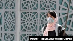 An Iranian woman wearing a face mask in Tehran on March 2