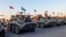Russian military vehicles sent to monitor the truce in Nagorno-Karabakh are parked on the airfield in Yerevan on November 12.