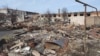 This grab taken from a handout footage released by the Russian Defence Ministry on March 13, 2025, shows destructions in the town of Sudzha in the Kursk region.