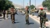 Afghan security forces arrive at the site of an explosion in Kabul on July 1.