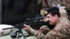 FILE: Raheel Sharif trying a rifle during his visit to the Pakistan Ordnance Factories in April 2015.