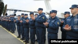Armenian doctors, sappers, and other military personnel attend a farewell ceremony at Yerevan airport before being deployed to Syria on February 8.