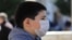 A child in Pristina wears a mask to protect against coronavirus.