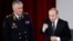Președintele rus President Vladimir Putin (dreapta) și ministrul de interne Vladimir Kolokolțev, martie 2016