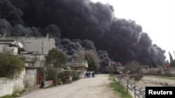 Сирия - Хомсту каптаган кара түтүн, 15-февраль, 2012.