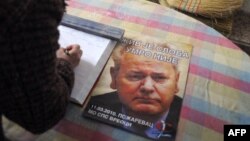 Slika Slobodana Miloševića na plakatu