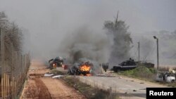 نمایی از هدف قرار گرفتن یک خودروی نظامی اسرائیل در مرز با لبنان توسط گروه حزب‌الله