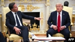 US President Donald Trump meets with NATO Secretary-General Mark Rutte (left) in the Oval Office of the White House in Washington, D.C., on July 14.