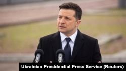 Ukrainian President Volodymyr Zelenskiy delivers a speech from the exclusion zone. 