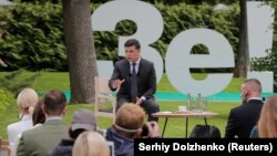 Ukrainian President Volodymyr Zelenskiy gestures during an open-air news conference in Kyiv on May 20.