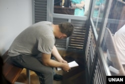 Патрульний поліцейський Іван Приходько, якого підозрюють у вбивстві 5-річного хлопчика. Засідання Голосіївського райсуду Києва, 4 червня 2019 року