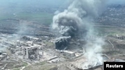 Последствия российских обстрелов в Мариуполе.