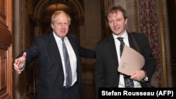 British Foreign Secretary Boris Johnson (left) meets with Richard Ratcliffe, the husband of British-Iranian woman Nazanin Zaghari-Ratcliffe who is jailed in Iran, in London on November 15. 