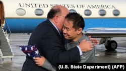 U.S. Ambassador to Switzerland Edward T. McMullen, Jr. welcomes Xiyue Wang on arrival in Switzerland after his release from Iran on December 7.