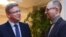 Єврокомісар Штефан Фюле (ліворуч) і лідер фракції «Батьківщина» Арсеній Яценюк, Київ, 11 лютого 2014 року