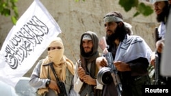 Taliban fighters during a cease-fire in the Ghanikhel district of Nangarhar Province in June (file photo)