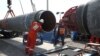 Workers in Russia's Leningrad region attend to a section of the Nord Stream 2 gas pipeline, which is now almost complete. (file photo)