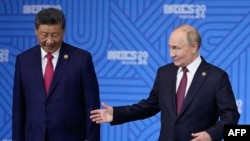 Си Цзиньпин и Владимир Путин во время саммита БРИКС в Казани, Россия, 23 октября 2024 года