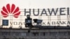 A surveillance camera is seen in front of a Huawei logo in Belgrade, Serbia. (File photo)