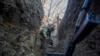 A Ukrainian soldier digs a trench near Horlivka in the Donetsk region.