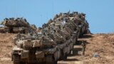 A convoy of Israeli tanks is deployed at Israel's border with the Gaza Strip on September 16, 2025.