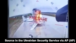 Скриншот из видео ударов СБУ по самолетам стратегической авиации России на аэродроме «Белая» в Иркутской области РФ. 1 июня 2025 года